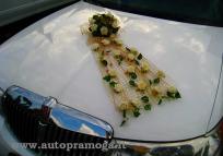 Rented limousine with decorations, artificial flowers bouquet, a ring lattice